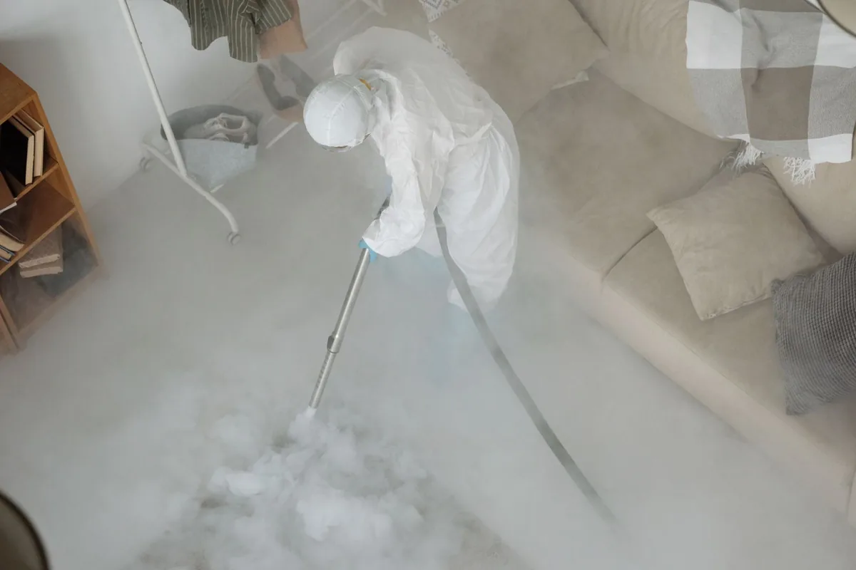 Biohazard cleanup technician in protective equipment, River Gardens, Sacramento, CA